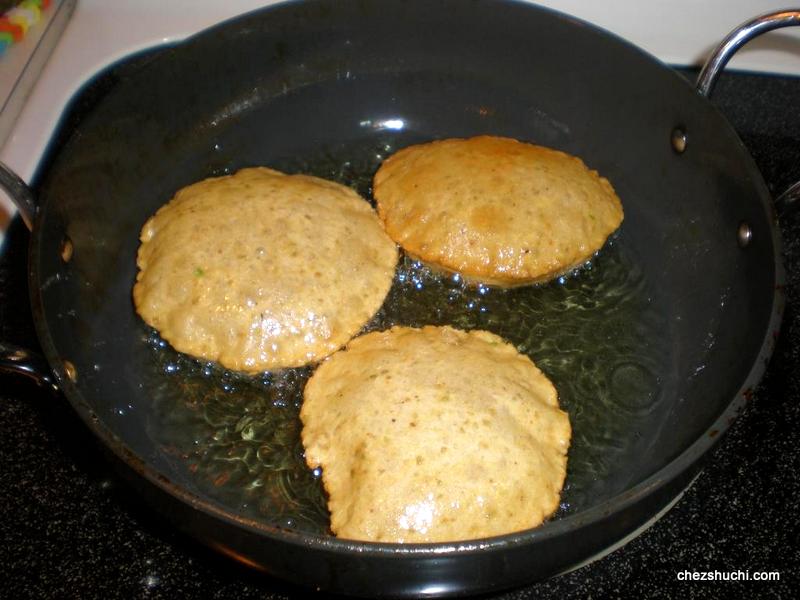 3 daal poori in the hot oil